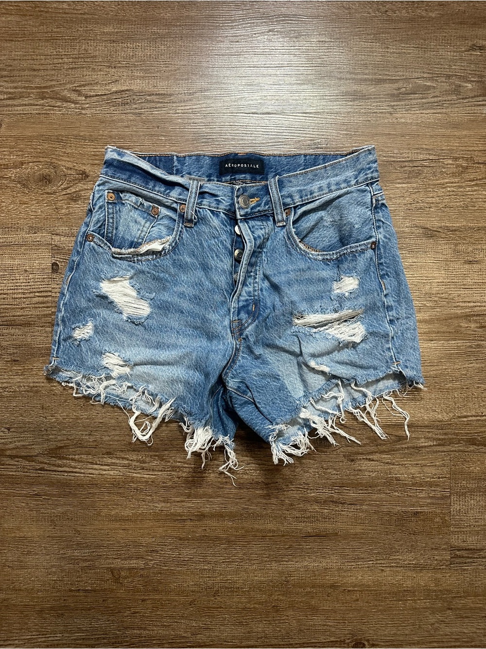 Distressed denim cutoff shorts